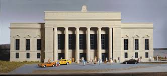 Walthers Union Station Item # 933-3094. For generations of travelers, Union Station was the magical gateway to and from the world. The Walthers Cornerstone Union Station will be the gateway to your layout! Here is where the journeys of the finest trains on the line started and ended. Where travelers rushed to make their connections. And thousands of commuters began and ended their workday. Where space was limited in larger towns and cities, two or more railroads would often combine their resources to build and operate major terminal stations. Monuments to the power and success of railroading, they also projected the spirit of the community they served and the promise of excellent service for anyone who traveled by train. Union Station is a fitting tribute to the grand terminals that served railroading for over 100 years. Whether your line runs heavyweights and steam, the flashy diesel streamliners of the 40s and 50s, or any of the colorful schemes and equipment of the Amtrak or VIA era, Union Station is an ideal focal point for passenger operations. Designed to capture the look and feel of similar prototypes across America, it puts big detail in a small space without overwhelming your layout. If space is limited, it can be the focal point of operations for an entire layout. And best of all, this unique kit is based on an American prototype, so it looks right and fits perfectly without kitbashing. All the classic design elements are here, from the tall support columns to the nonworking clock on the roof. Each wall captures the look of cut-stone construction and is molded in color so painting is an option. Separate doors and windows, along with molded-in cut lines on the back of each wall simplify customizing. The large roof is neatly detailed with large skylights and numerous vents to make it more realistic. End-door canopies, realistic decals and many other details are also included. Complete your Union Station scene with a train shed or platform shelters - see themhere.
 North American Prototype
Ornate front entrance with realistic cut-stone wall detail
Fits steam or diesel-era layouts from the 1900s and beyond
Realistic decals
realistic columns, canopies and non-working clock detail
Easy-to-build plastic kit
Molded in appropriate colors