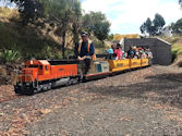The Altona Miniature Railway (AMR) is a hobby club run by members that provide miniature train rides on scaled steam and diesel engines (5″ and 7 1/4″ gauge), over our 1.5 km length track in Altona Australia. Membership with Altona Miniature Railway is available to anyone who is interested in trains, scale model railroading, engineering, gardening or being involved in the local community. Altona Miniature Railway is a family friendly club that welcomes new members and their families.