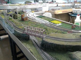 A historic model train station with period-accurate locomotives and platforms.