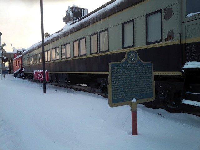 Welcome to the Ron Morel Memorial Museum in Kapuskasing Ontario Canada

This site's collection focuses on the Kapuskasing region from 1914 to the present. The museum is housed in two Canadian National Railway coaches, an engine and a caboose. There is a permanent exhibit on Kapuskasing's World War I internment camp ( www.cdli.ca/monuments/on/kapplaq.htm ), and new exhibits every season on various aspects of Kapuskasing. Working HO-gauge and N-gauge railway models are sure to delight young and older visitors alike.

The Ron Morel Memorial Museum, housed in locomotive #5107, was founded in 1971 by the late Ron Morel Sr. whose vision was to showcase two of his passions -local history and trains. The museum has something for everyone.
