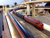 Welcome to the Los Angeles N-Scale Association, operators of East Valley Lines Model Railroad located since 1979 in the Travel Town Museum at Griffith Park. View pitchers of the East Valley Lines N Scale Model Railroad and see what they have done to their N scale layout. They operate one of the largest N-Scale layouts in the world. This is just a brief trip on the East Valley Lines' trackage. As you observe closely, there are lots of details to enjoy. This is truly a labor of love, involving countless hours, money and the talents of the many N-Scale modelers dedicated to the memory of great railroads. Brought to you to by www.krafttrains.com