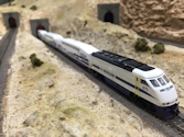 Welcome to the Los Angeles N-Scale Association, operators of East Valley Lines Model Railroad located since 1979 in the Travel Town Museum at Griffith Park. View pitchers of the East Valley Lines N Scale Model Railroad and see what they have done to their N scale layout. They operate one of the largest N-Scale layouts in the world. This is just a brief trip on the East Valley Lines' trackage. As you observe closely, there are lots of details to enjoy. This is truly a labor of love, involving countless hours, money and the talents of the many N-Scale modelers dedicated to the memory of great railroads. Brought to you to by www.krafttrains.com