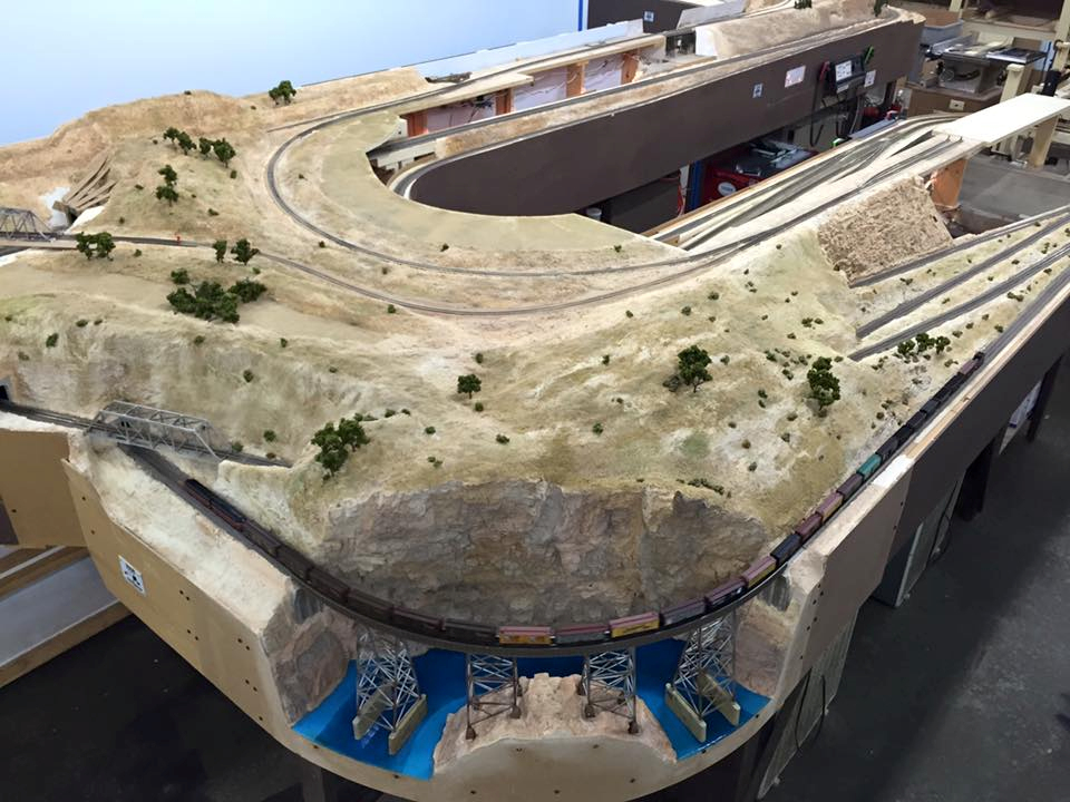 Welcome to the Los Angeles N-Scale Association, operators of East Valley Lines Model Railroad club located since 1979 in the Travel Town Museum at Griffith Los Angeles, California. View pitchers of the East Valley Lines N Scale Model Railroad club and see what they have done to their N scale layout. They operate one of the largest N-Scale layouts in the world. This is just a brief trip on the East Valley Lines' trackage. As you observe closely, there are lots of details to enjoy. This is truly a labor of love, involving countless hours, money and the talents of the many N-Scale modelers dedicated to the memory of great railroads. Brought to you to by www.krafttrains.com