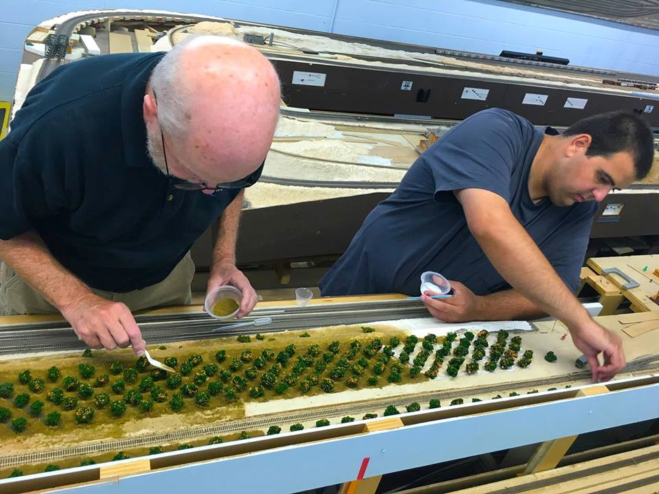 Welcome to the Los Angeles N-Scale Association, operators of East Valley Lines Model Railroad club located since 1979 in the Travel Town Museum at Griffith Los Angeles, California. View pitchers of the East Valley Lines N Scale Model Railroad club and see what they have done to their N scale layout. They operate one of the largest N-Scale layouts in the world. This is just a brief trip on the East Valley Lines' trackage. As you observe closely, there are lots of details to enjoy. This is truly a labor of love, involving countless hours, money and the talents of the many N-Scale modelers dedicated to the memory of great railroads. Brought to you to by www.krafttrains.com