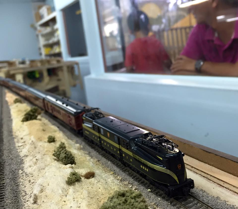 Welcome to the Los Angeles N-Scale Association, operators of East Valley Lines Model Railroad club located since 1979 in the Travel Town Museum at Griffith Los Angeles, California. View pitchers of the East Valley Lines N Scale Model Railroad club and see what they have done to their N scale layout. They operate one of the largest N-Scale layouts in the world. This is just a brief trip on the East Valley Lines' trackage. As you observe closely, there are lots of details to enjoy. This is truly a labor of love, involving countless hours, money and the talents of the many N-Scale modelers dedicated to the memory of great railroads. Brought to you to by www.krafttrains.com