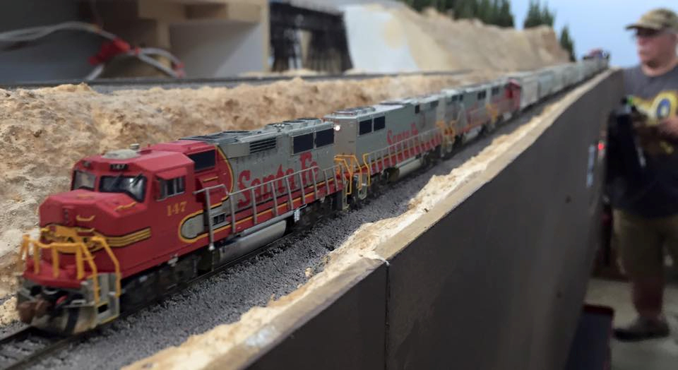 Welcome to the Los Angeles N-Scale Association, operators of East Valley Lines Model Railroad club located since 1979 in the Travel Town Museum at Griffith Los Angeles, California. View pitchers of the East Valley Lines N Scale Model Railroad club and see what they have done to their N scale layout. They operate one of the largest N-Scale layouts in the world. This is just a brief trip on the East Valley Lines' trackage. As you observe closely, there are lots of details to enjoy. This is truly a labor of love, involving countless hours, money and the talents of the many N-Scale modelers dedicated to the memory of great railroads. Brought to you to by www.krafttrains.com