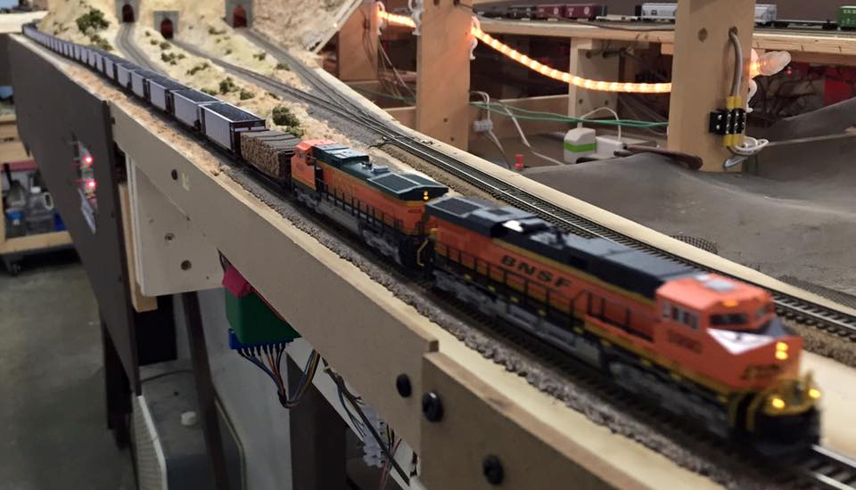 Welcome to the Los Angeles N-Scale Association, operators of East Valley Lines Model Railroad club located since 1979 in the Travel Town Museum at Griffith Los Angeles, California. View pitchers of the East Valley Lines N Scale Model Railroad club and see what they have done to their N scale layout. They operate one of the largest N-Scale layouts in the world. This is just a brief trip on the East Valley Lines' trackage. As you observe closely, there are lots of details to enjoy. This is truly a labor of love, involving countless hours, money and the talents of the many N-Scale modelers dedicated to the memory of great railroads. Brought to you to by www.krafttrains.com