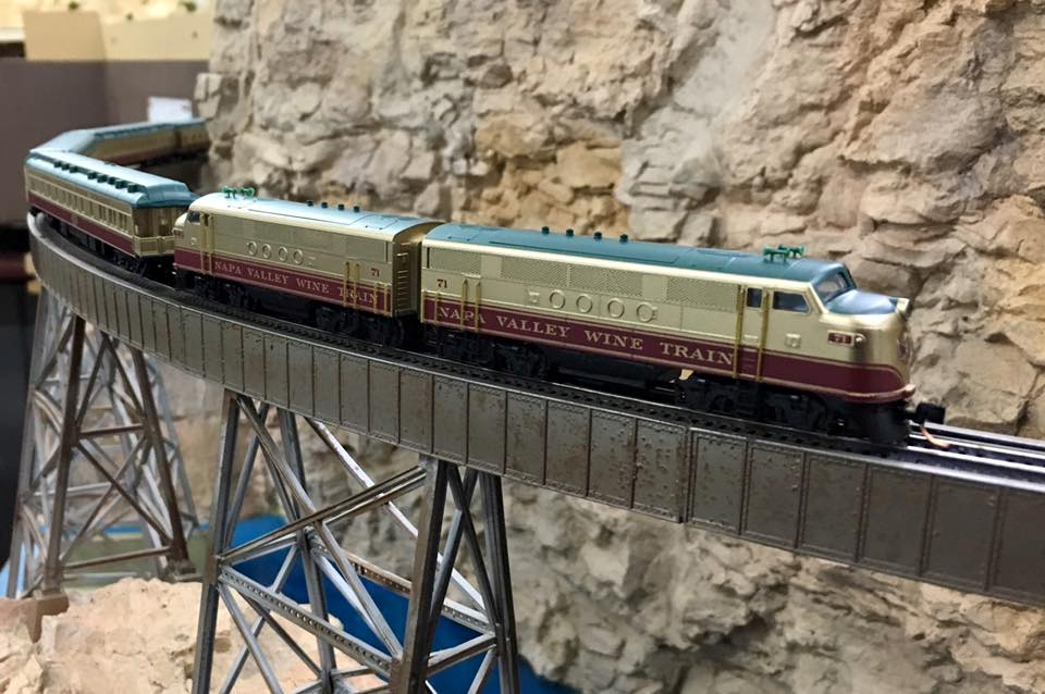 Welcome to the Los Angeles N-Scale Association, operators of East Valley Lines Model Railroad club located since 1979 in the Travel Town Museum at Griffith Los Angeles, California. View pitchers of the East Valley Lines N Scale Model Railroad club and see what they have done to their N scale layout. They operate one of the largest N-Scale layouts in the world. This is just a brief trip on the East Valley Lines' trackage. As you observe closely, there are lots of details to enjoy. This is truly a labor of love, involving countless hours, money and the talents of the many N-Scale modelers dedicated to the memory of great railroads. Brought to you to by www.krafttrains.com