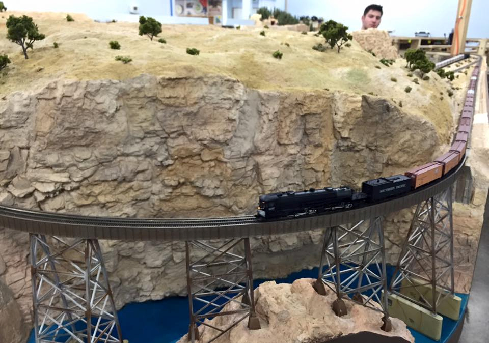 Welcome to the Los Angeles N-Scale Association, operators of East Valley Lines Model Railroad club located since 1979 in the Travel Town Museum at Griffith Los Angeles, California. View pitchers of the East Valley Lines N Scale Model Railroad club and see what they have done to their N scale layout. They operate one of the largest N-Scale layouts in the world. This is just a brief trip on the East Valley Lines' trackage. As you observe closely, there are lots of details to enjoy. This is truly a labor of love, involving countless hours, money and the talents of the many N-Scale modelers dedicated to the memory of great railroads. Brought to you to by www.krafttrains.com