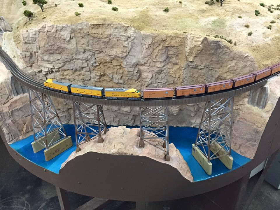 Welcome to the Los Angeles N-Scale Association, operators of East Valley Lines Model Railroad club located since 1979 in the Travel Town Museum at Griffith Los Angeles, California. View pitchers of the East Valley Lines N Scale Model Railroad club and see what they have done to their N scale layout. They operate one of the largest N-Scale layouts in the world. This is just a brief trip on the East Valley Lines' trackage. As you observe closely, there are lots of details to enjoy. This is truly a labor of love, involving countless hours, money and the talents of the many N-Scale modelers dedicated to the memory of great railroads. Brought to you to by www.krafttrains.com