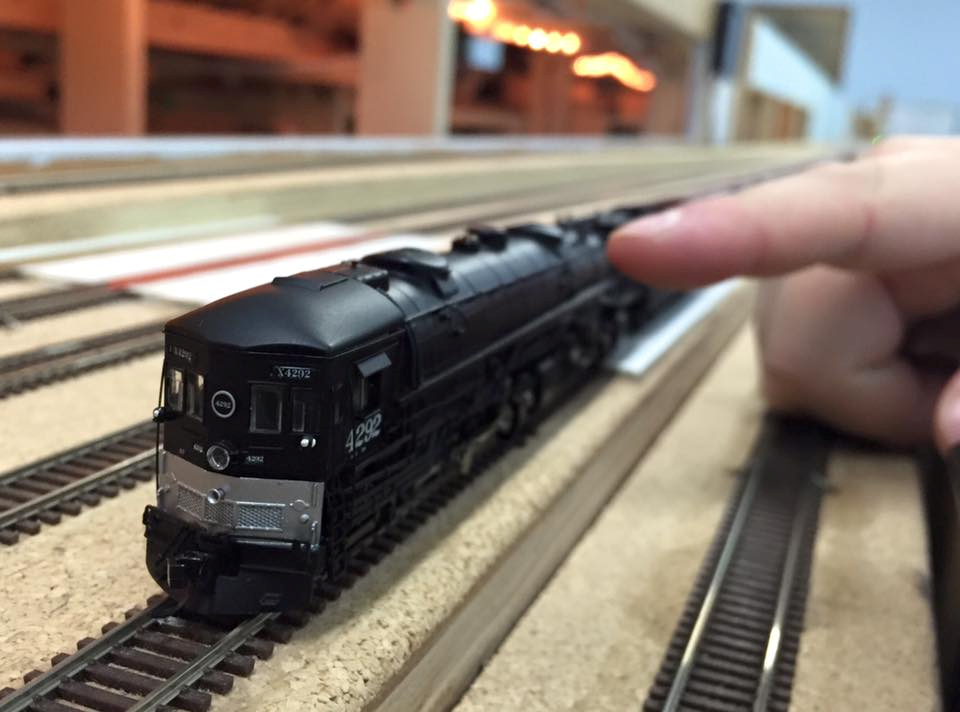 Welcome to the Los Angeles N-Scale Association, operators of East Valley Lines Model Railroad club located since 1979 in the Travel Town Museum at Griffith Los Angeles, California. View pitchers of the East Valley Lines N Scale Model Railroad club and see what they have done to their N scale layout. They operate one of the largest N-Scale layouts in the world. This is just a brief trip on the East Valley Lines' trackage. As you observe closely, there are lots of details to enjoy. This is truly a labor of love, involving countless hours, money and the talents of the many N-Scale modelers dedicated to the memory of great railroads. Brought to you to by www.krafttrains.com