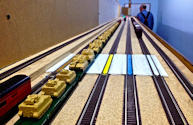 Welcome to the Los Angeles N-Scale Association, operators of East Valley Lines Model Railroad located since 1979 in the Travel Town Museum at Griffith Park. View pitchers of the East Valley Lines N Scale Model Railroad and see what they have done to their N scale layout. They operate one of the largest N-Scale layouts in the world. This is just a brief trip on the East Valley Lines' trackage. As you observe closely, there are lots of details to enjoy. This is truly a labor of love, involving countless hours, money and the talents of the many N-Scale modelers dedicated to the memory of great railroads. Brought to you to by www.krafttrains.com