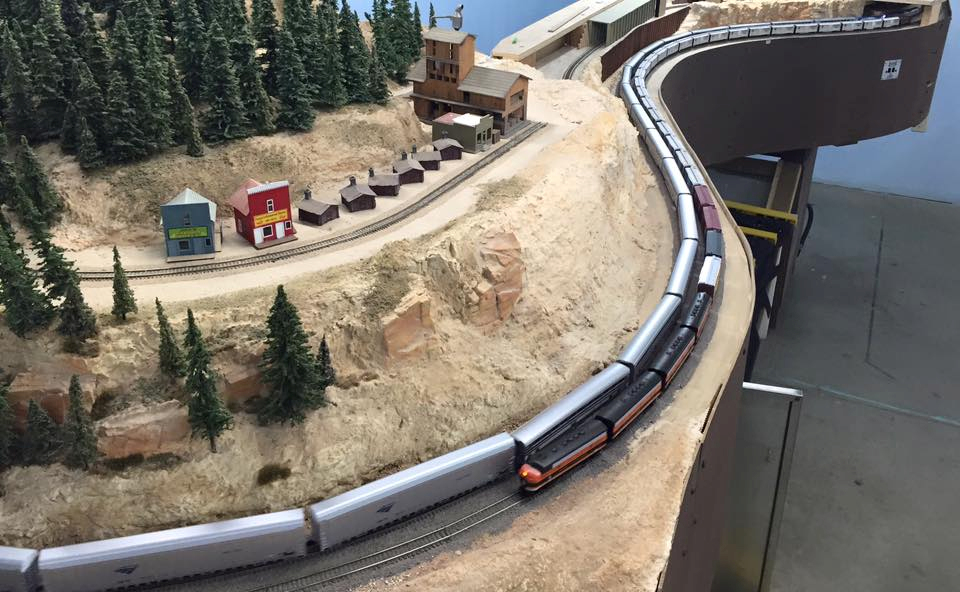 Welcome to the Los Angeles N-Scale Association, operators of East Valley Lines Model Railroad club located since 1979 in the Travel Town Museum at Griffith Los Angeles, California. View pitchers of the East Valley Lines N Scale Model Railroad club and see what they have done to their N scale layout. They operate one of the largest N-Scale layouts in the world. This is just a brief trip on the East Valley Lines' trackage. As you observe closely, there are lots of details to enjoy. This is truly a labor of love, involving countless hours, money and the talents of the many N-Scale modelers dedicated to the memory of great railroads. Brought to you to by www.krafttrains.com