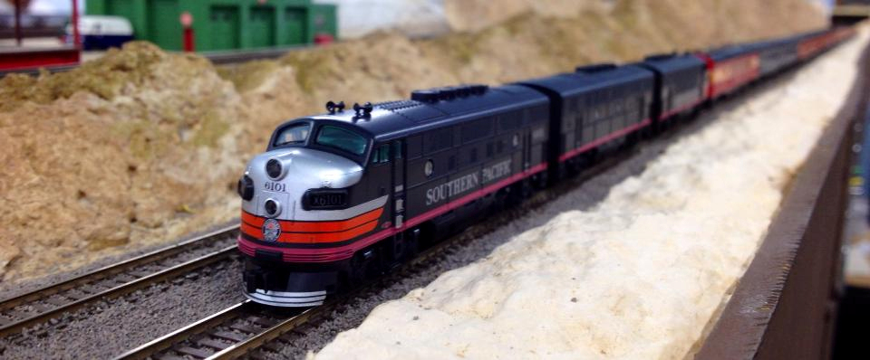 Welcome to the Los Angeles N-Scale Association, operators of East Valley Lines Model Railroad club located since 1979 in the Travel Town Museum at Griffith Los Angeles, California. View pitchers of the East Valley Lines N Scale Model Railroad club and see what they have done to their N scale layout. They operate one of the largest N-Scale layouts in the world. This is just a brief trip on the East Valley Lines' trackage. As you observe closely, there are lots of details to enjoy. This is truly a labor of love, involving countless hours, money and the talents of the many N-Scale modelers dedicated to the memory of great railroads. Brought to you to by www.krafttrains.com