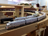 Welcome to the Los Angeles N-Scale Association, operators of East Valley Lines Model Railroad located since 1979 in the Travel Town Museum at Griffith Park. View pitchers of the East Valley Lines N Scale Model Railroad and see what they have done to their N scale layout. They operate one of the largest N-Scale layouts in the world. This is just a brief trip on the East Valley Lines' trackage. As you observe closely, there are lots of details to enjoy. This is truly a labor of love, involving countless hours, money and the talents of the many N-Scale modelers dedicated to the memory of great railroads. Brought to you to by www.krafttrains.com