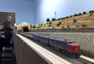 Welcome to the Los Angeles N-Scale Association, operators of East Valley Lines Model Railroad located since 1979 in the Travel Town Museum at Griffith Park. View pitchers of the East Valley Lines N Scale Model Railroad and see what they have done to their N scale layout. They operate one of the largest N-Scale layouts in the world. This is just a brief trip on the East Valley Lines' trackage. As you observe closely, there are lots of details to enjoy. This is truly a labor of love, involving countless hours, money and the talents of the many N-Scale modelers dedicated to the memory of great railroads. Brought to you to by www.krafttrains.com
