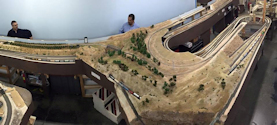 Welcome to the Los Angeles N-Scale Association, operators of East Valley Lines Model Railroad located since 1979 in the Travel Town Museum at Griffith Park. View pitchers of the East Valley Lines N Scale Model Railroad and see what they have done to their N scale layout. They operate one of the largest N-Scale layouts in the world. This is just a brief trip on the East Valley Lines' trackage. As you observe closely, there are lots of details to enjoy. This is truly a labor of love, involving countless hours, money and the talents of the many N-Scale modelers dedicated to the memory of great railroads. Brought to you to by www.krafttrains.com