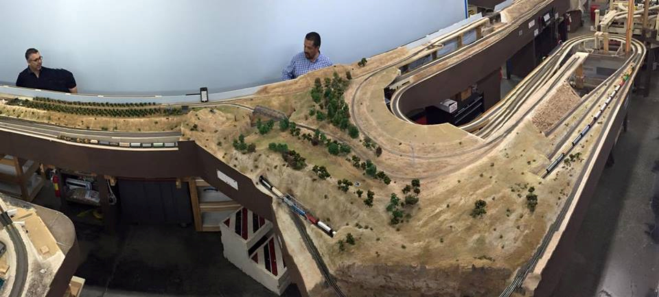 Welcome to the Los Angeles N-Scale Association, operators of East Valley Lines Model Railroad club located since 1979 in the Travel Town Museum at Griffith Los Angeles, California. View pitchers of the East Valley Lines N Scale Model Railroad club and see what they have done to their N scale layout. They operate one of the largest N-Scale layouts in the world. This is just a brief trip on the East Valley Lines' trackage. As you observe closely, there are lots of details to enjoy. This is truly a labor of love, involving countless hours, money and the talents of the many N-Scale modelers dedicated to the memory of great railroads. Brought to you to by www.krafttrains.com