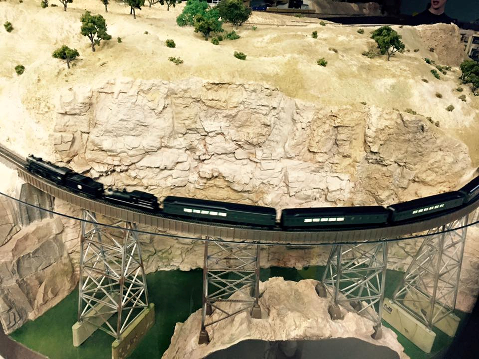 Welcome to the Los Angeles N-Scale Association, operators of East Valley Lines Model Railroad club located since 1979 in the Travel Town Museum at Griffith Los Angeles, California. View pitchers of the East Valley Lines N Scale Model Railroad club and see what they have done to their N scale layout. They operate one of the largest N-Scale layouts in the world. This is just a brief trip on the East Valley Lines' trackage. As you observe closely, there are lots of details to enjoy. This is truly a labor of love, involving countless hours, money and the talents of the many N-Scale modelers dedicated to the memory of great railroads. Brought to you to by www.krafttrains.com
