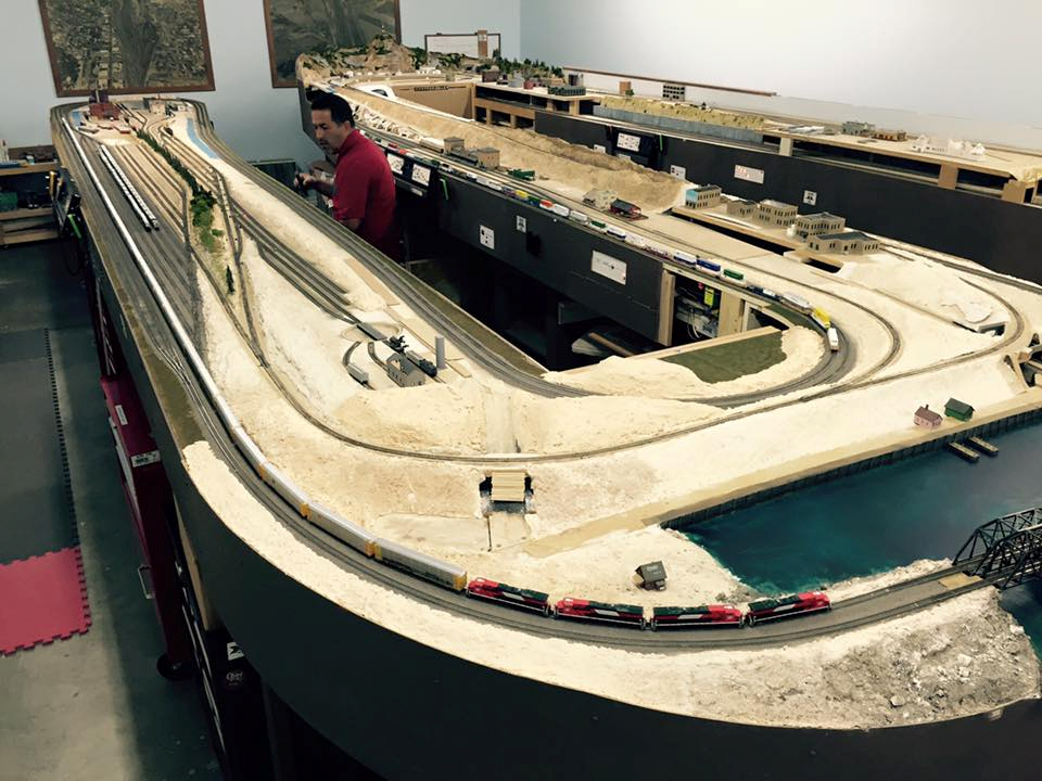 Welcome to the Los Angeles N-Scale Association, operators of East Valley Lines Model Railroad club located since 1979 in the Travel Town Museum at Griffith Los Angeles, California. View pitchers of the East Valley Lines N Scale Model Railroad club and see what they have done to their N scale layout. They operate one of the largest N-Scale layouts in the world. This is just a brief trip on the East Valley Lines' trackage. As you observe closely, there are lots of details to enjoy. This is truly a labor of love, involving countless hours, money and the talents of the many N-Scale modelers dedicated to the memory of great railroads. Brought to you to by www.krafttrains.com