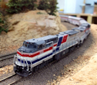 Welcome to the Los Angeles N-Scale Association, operators of East Valley Lines Model Railroad located since 1979 in the Travel Town Museum at Griffith Park. View pitchers of the East Valley Lines N Scale Model Railroad and see what they have done to their N scale layout. They operate one of the largest N-Scale layouts in the world. This is just a brief trip on the East Valley Lines' trackage. As you observe closely, there are lots of details to enjoy. This is truly a labor of love, involving countless hours, money and the talents of the many N-Scale modelers dedicated to the memory of great railroads. Brought to you to by www.krafttrains.com