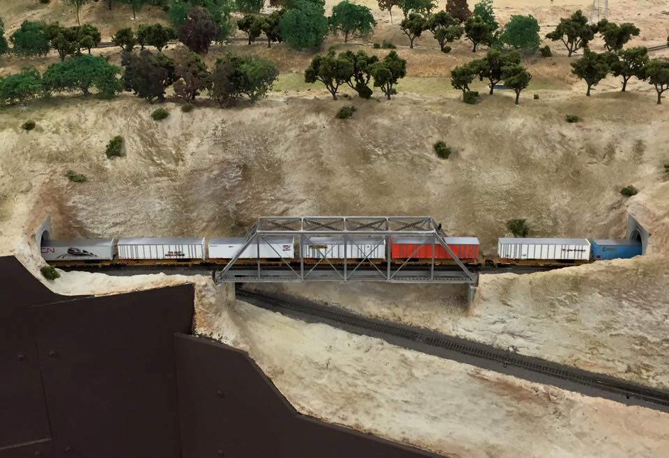 Welcome to the Los Angeles N-Scale Association, operators of East Valley Lines Model Railroad club located since 1979 in the Travel Town Museum at Griffith Los Angeles, California. View pitchers of the East Valley Lines N Scale Model Railroad club and see what they have done to their N scale layout. They operate one of the largest N-Scale layouts in the world. This is just a brief trip on the East Valley Lines' trackage. As you observe closely, there are lots of details to enjoy. This is truly a labor of love, involving countless hours, money and the talents of the many N-Scale modelers dedicated to the memory of great railroads. Brought to you to by www.krafttrains.com