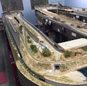 Welcome to the Los Angeles N-Scale Association, operators of East Valley Lines Model Railroad located since 1979 in the Travel Town Museum at Griffith Park. View pitchers of the East Valley Lines N Scale Model Railroad and see what they have done to their N scale layout. They operate one of the largest N-Scale layouts in the world. This is just a brief trip on the East Valley Lines' trackage. As you observe closely, there are lots of details to enjoy. This is truly a labor of love, involving countless hours, money and the talents of the many N-Scale modelers dedicated to the memory of great railroads. Brought to you to by www.krafttrains.com