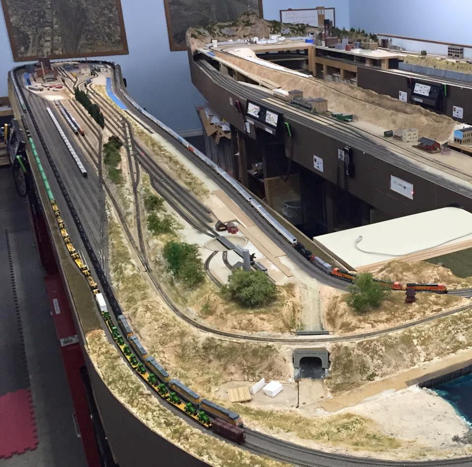 Welcome to the Los Angeles N-Scale Association, operators of East Valley Lines Model Railroad club located since 1979 in the Travel Town Museum at Griffith Los Angeles, California. View pitchers of the East Valley Lines N Scale Model Railroad club and see what they have done to their N scale layout. They operate one of the largest N-Scale layouts in the world. This is just a brief trip on the East Valley Lines' trackage. As you observe closely, there are lots of details to enjoy. This is truly a labor of love, involving countless hours, money and the talents of the many N-Scale modelers dedicated to the memory of great railroads. Brought to you to by www.krafttrains.com