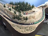 Welcome to the Los Angeles N-Scale Association, operators of East Valley Lines Model Railroad located since 1979 in the Travel Town Museum at Griffith Park. View pitchers of the East Valley Lines N Scale Model Railroad and see what they have done to their N scale layout. They operate one of the largest N-Scale layouts in the world. This is just a brief trip on the East Valley Lines' trackage. As you observe closely, there are lots of details to enjoy. This is truly a labor of love, involving countless hours, money and the talents of the many N-Scale modelers dedicated to the memory of great railroads. Brought to you to by www.krafttrains.com