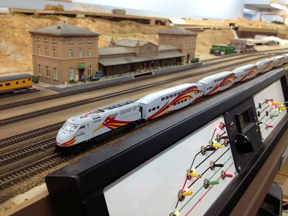 Welcome to the Los Angeles N-Scale Association, operators of East Valley Lines Model Railroad club located since 1979 in the Travel Town Museum at Griffith Los Angeles, California. View pitchers of the East Valley Lines N Scale Model Railroad club and see what they have done to their N scale layout. They operate one of the largest N-Scale layouts in the world. This is just a brief trip on the East Valley Lines' trackage. As you observe closely, there are lots of details to enjoy. This is truly a labor of love, involving countless hours, money and the talents of the many N-Scale modelers dedicated to the memory of great railroads. Brought to you to by www.krafttrains.com