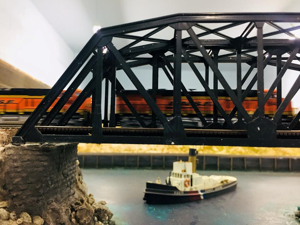 Welcome to the Los Angeles N-Scale Association, operators of East Valley Lines Model Railroad club located since 1979 in the Travel Town Museum at Griffith Los Angeles, California. View pitchers of the East Valley Lines N Scale Model Railroad club and see what they have done to their N scale layout. They operate one of the largest N-Scale layouts in the world. This is just a brief trip on the East Valley Lines' trackage. As you observe closely, there are lots of details to enjoy. This is truly a labor of love, involving countless hours, money and the talents of the many N-Scale modelers dedicated to the memory of great railroads. Brought to you to by www.krafttrains.com