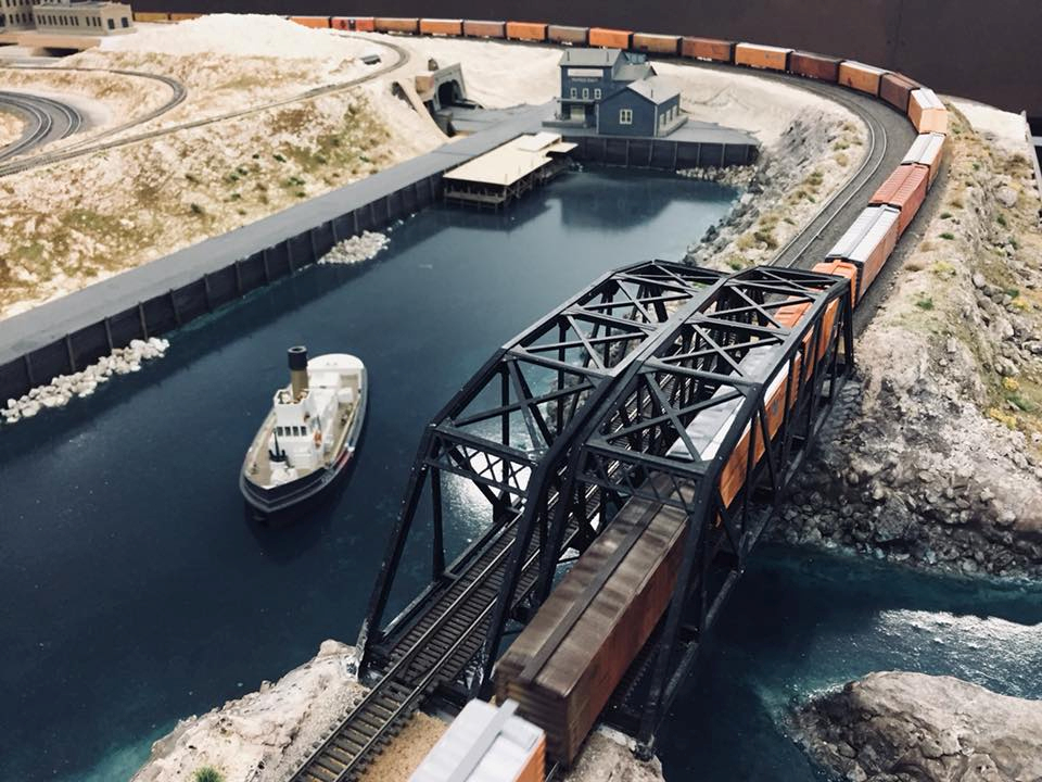 Welcome to the Los Angeles N-Scale Association, operators of East Valley Lines Model Railroad club located since 1979 in the Travel Town Museum at Griffith Los Angeles, California. View pitchers of the East Valley Lines N Scale Model Railroad club and see what they have done to their N scale layout. They operate one of the largest N-Scale layouts in the world. This is just a brief trip on the East Valley Lines' trackage. As you observe closely, there are lots of details to enjoy. This is truly a labor of love, involving countless hours, money and the talents of the many N-Scale modelers dedicated to the memory of great railroads. Brought to you to by www.krafttrains.com