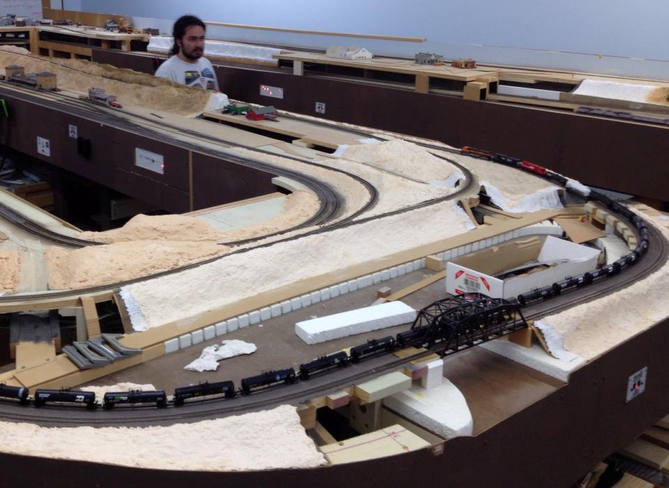 Welcome to the Los Angeles N-Scale Association, operators of East Valley Lines Model Railroad club located since 1979 in the Travel Town Museum at Griffith Los Angeles, California. View pitchers of the East Valley Lines N Scale Model Railroad club and see what they have done to their N scale layout. They operate one of the largest N-Scale layouts in the world. This is just a brief trip on the East Valley Lines' trackage. As you observe closely, there are lots of details to enjoy. This is truly a labor of love, involving countless hours, money and the talents of the many N-Scale modelers dedicated to the memory of great railroads. Brought to you to by www.krafttrains.com