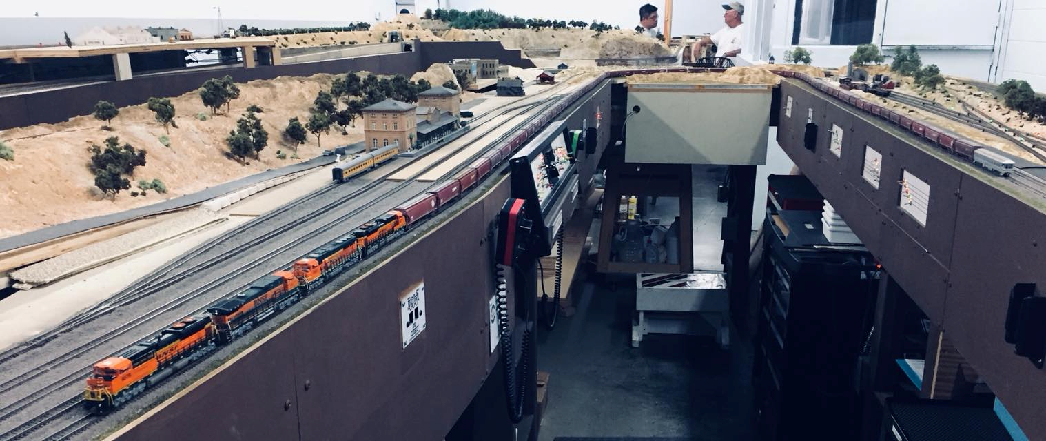 Welcome to the Los Angeles N-Scale Association, operators of East Valley Lines Model Railroad club located since 1979 in the Travel Town Museum at Griffith Los Angeles, California. View pitchers of the East Valley Lines N Scale Model Railroad club and see what they have done to their N scale layout. They operate one of the largest N-Scale layouts in the world. This is just a brief trip on the East Valley Lines' trackage. As you observe closely, there are lots of details to enjoy. This is truly a labor of love, involving countless hours, money and the talents of the many N-Scale modelers dedicated to the memory of great railroads. Brought to you to by www.krafttrains.com