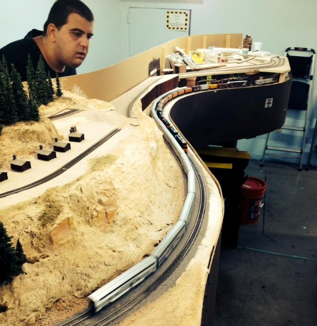 Welcome to the Los Angeles N-Scale Association, operators of East Valley Lines Model Railroad club located since 1979 in the Travel Town Museum at Griffith Los Angeles, California. View pitchers of the East Valley Lines N Scale Model Railroad club and see what they have done to their N scale layout. They operate one of the largest N-Scale layouts in the world. This is just a brief trip on the East Valley Lines' trackage. As you observe closely, there are lots of details to enjoy. This is truly a labor of love, involving countless hours, money and the talents of the many N-Scale modelers dedicated to the memory of great railroads. Brought to you to by www.krafttrains.com