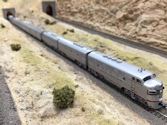 Welcome to the Los Angeles N-Scale Association, operators of East Valley Lines Model Railroad located since 1979 in the Travel Town Museum at Griffith Park. View pitchers of the East Valley Lines N Scale Model Railroad and see what they have done to their N scale layout. They operate one of the largest N-Scale layouts in the world. This is just a brief trip on the East Valley Lines' trackage. As you observe closely, there are lots of details to enjoy. This is truly a labor of love, involving countless hours, money and the talents of the many N-Scale modelers dedicated to the memory of great railroads. Brought to you to by www.krafttrains.com