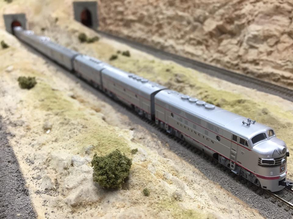 Welcome to the Los Angeles N-Scale Association, operators of East Valley Lines Model Railroad club located since 1979 in the Travel Town Museum at Griffith Los Angeles, California. View pitchers of the East Valley Lines N Scale Model Railroad club and see what they have done to their N scale layout. They operate one of the largest N-Scale layouts in the world. This is just a brief trip on the East Valley Lines' trackage. As you observe closely, there are lots of details to enjoy. This is truly a labor of love, involving countless hours, money and the talents of the many N-Scale modelers dedicated to the memory of great railroads. Brought to you to by www.krafttrains.com