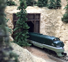 Welcome to the Los Angeles N-Scale Association, operators of East Valley Lines Model Railroad located since 1979 in the Travel Town Museum at Griffith Park. View pitchers of the East Valley Lines N Scale Model Railroad and see what they have done to their N scale layout. They operate one of the largest N-Scale layouts in the world. This is just a brief trip on the East Valley Lines' trackage. As you observe closely, there are lots of details to enjoy. This is truly a labor of love, involving countless hours, money and the talents of the many N-Scale modelers dedicated to the memory of great railroads. Brought to you to by www.krafttrains.com